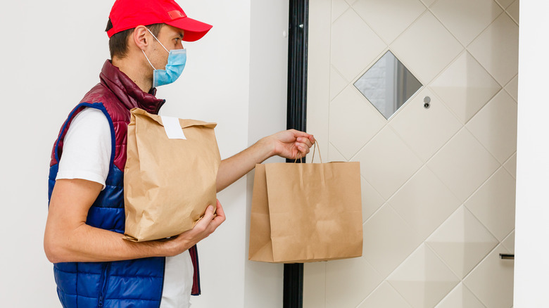 Delivery person with food bags