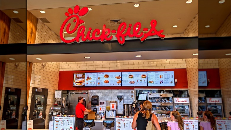 Chick-fil-A store with menu and customers