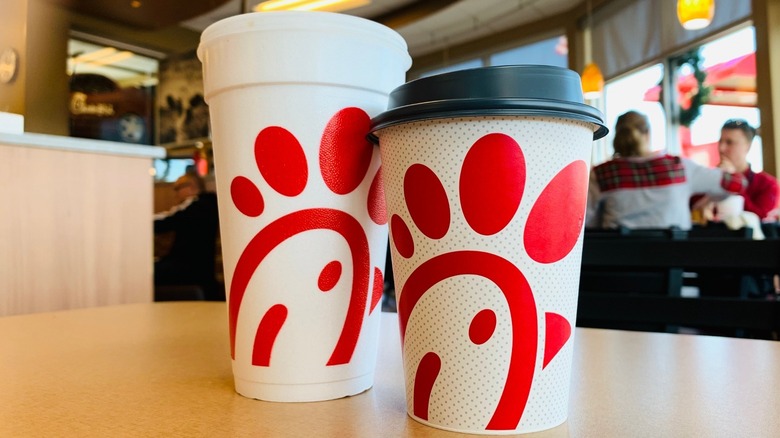 chick-fil-a paper cup next to styrofoam cup
