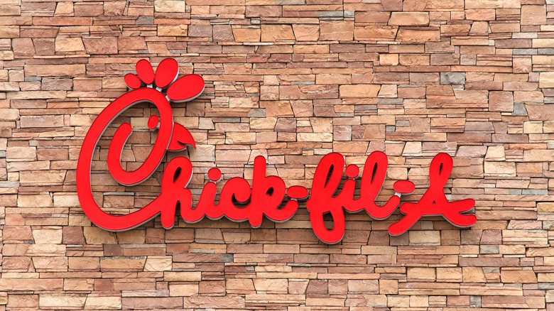 Chick-fil-a logo and name on a rock storefront