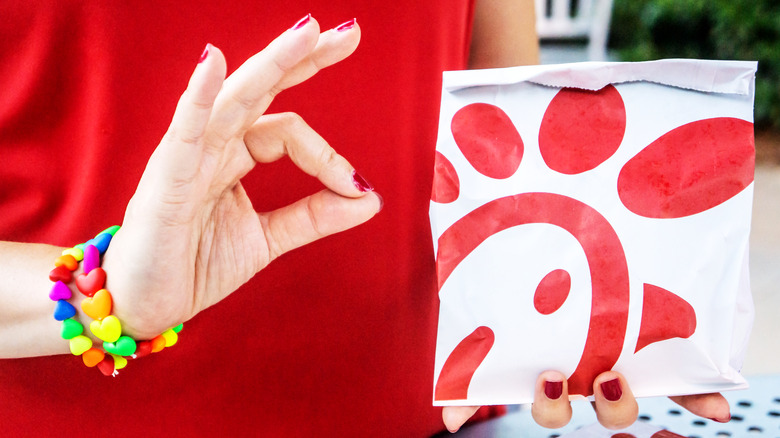 Chick-fil-A bag and hand