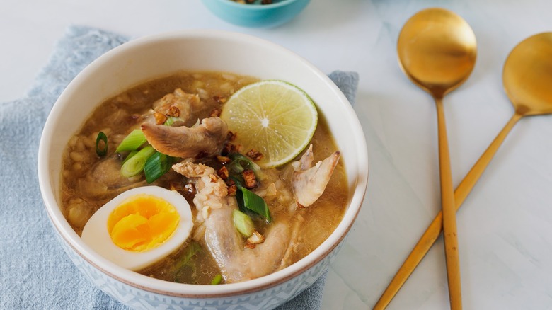 white bowl with chicken arroz caldo