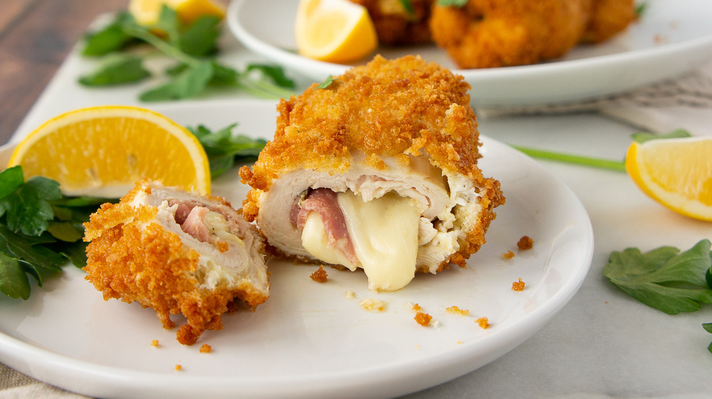 sliced chicken cordon bleu with cheese melting out