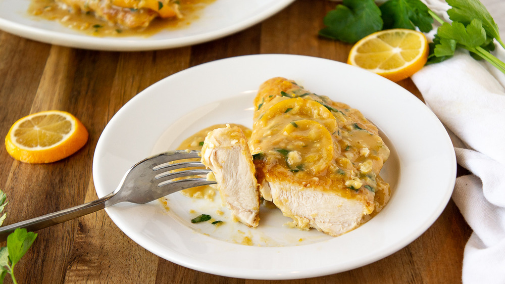 white plate with a chicken francese cutlet