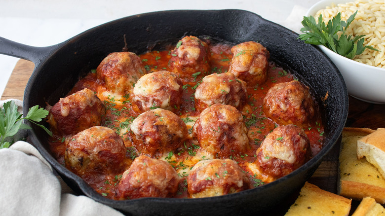 Chicken parmesan meatballs in cast iron skillet