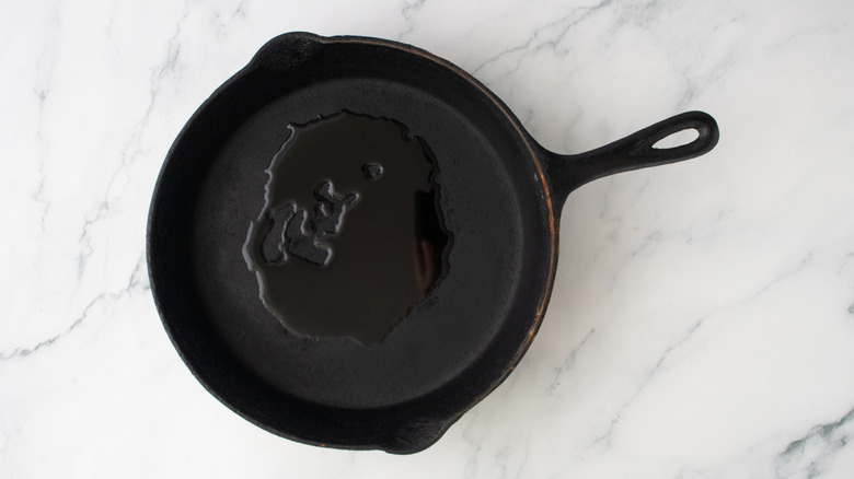 Drizzle of oil in skillet