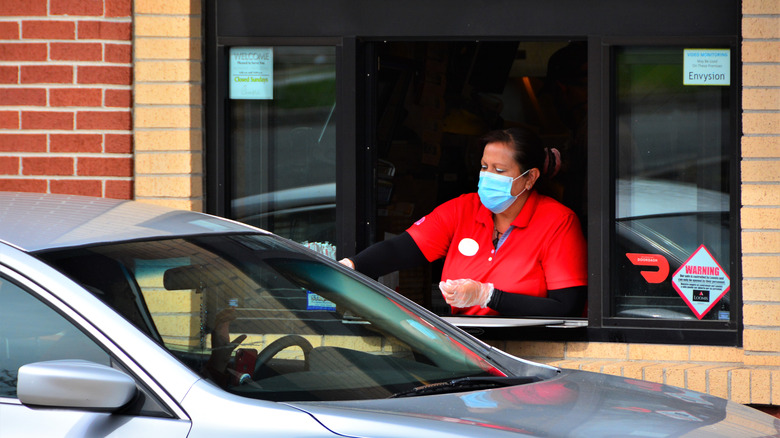 Chick-fil-A employee at drive-thru window