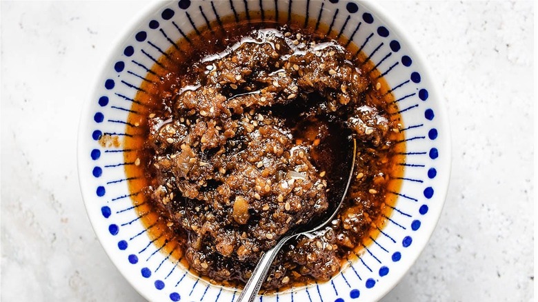 bowl of sacha sauce with spoon 