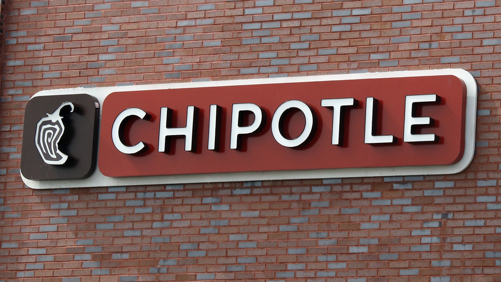 Chipotle sign on brick exterior
