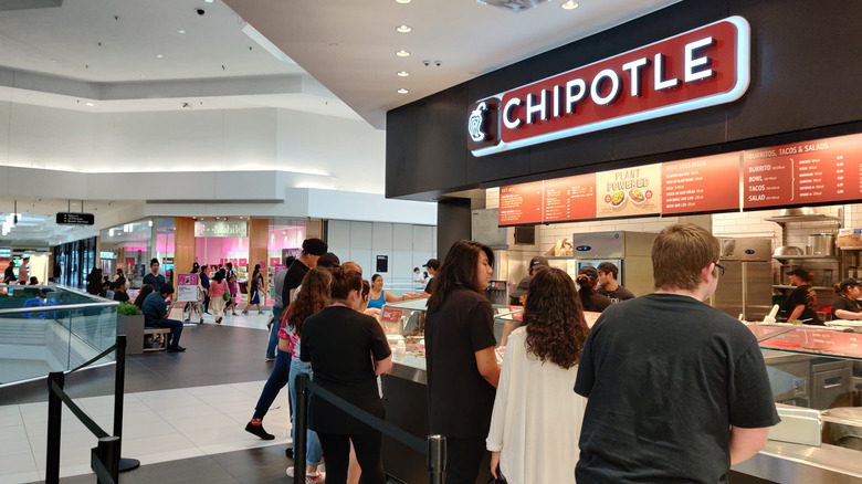 diners waiting at Chipotle restaurant