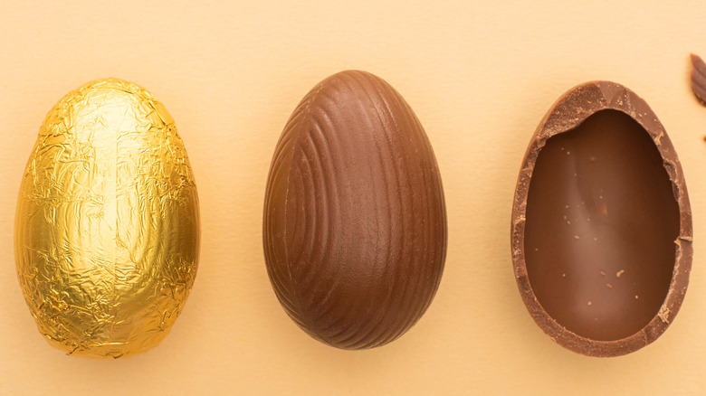 top view of chocolate easter eggs on beige background