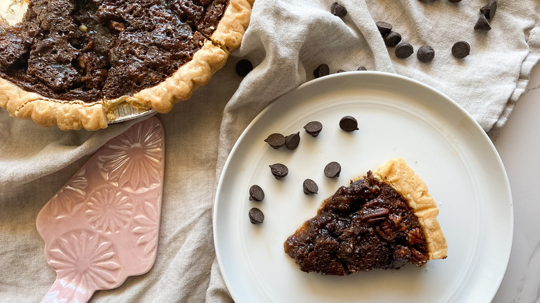 Chocolate pecan pie slice on a table