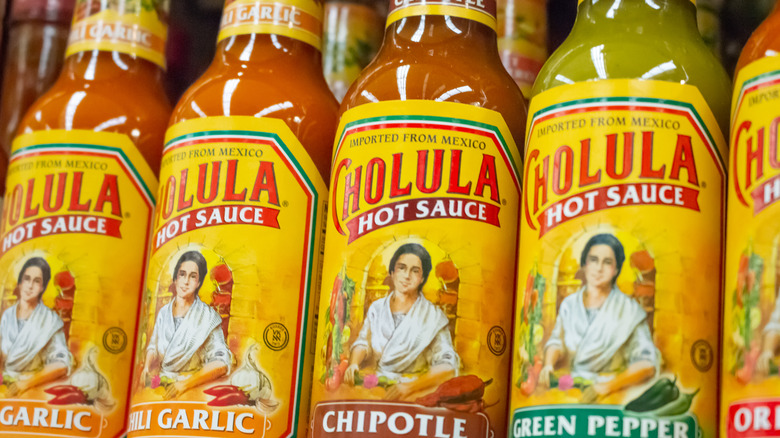 Row of Cholula hot sauce bottles