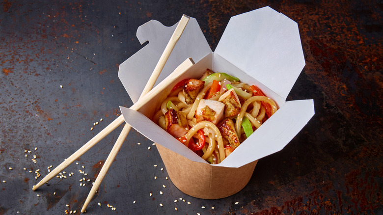 Box of Chinese takeout with chopsticks