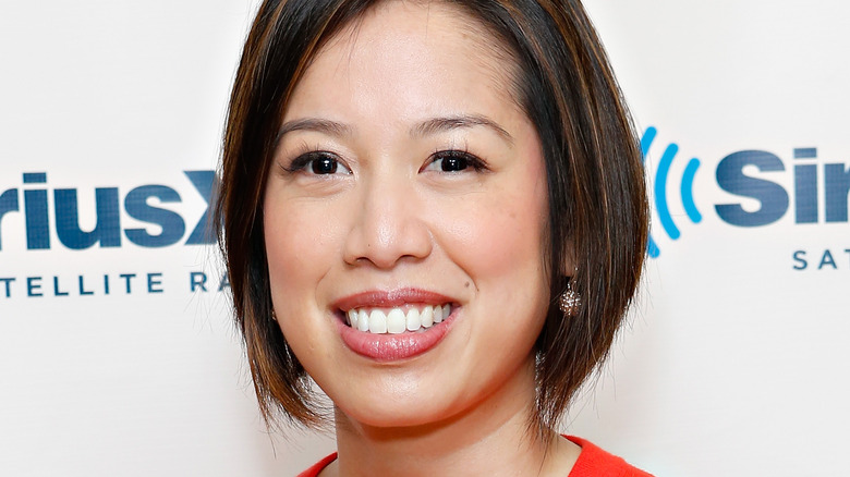 Christine Ha smiling in red sweater