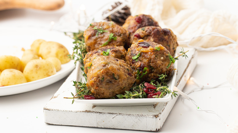 garnished meatballs on platter