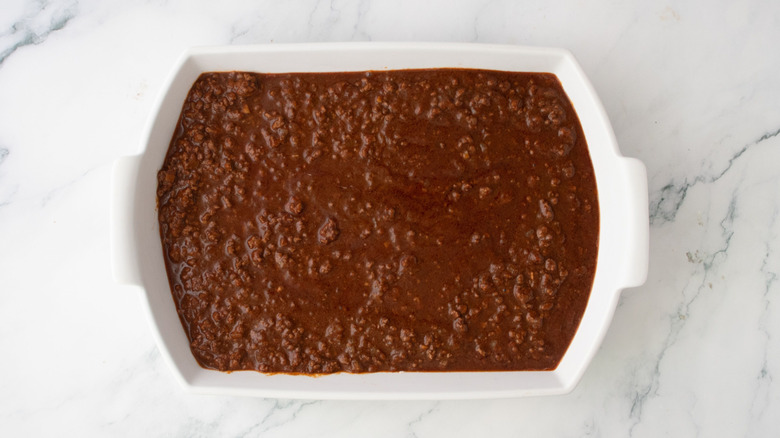 Chili spread out in casserole dish