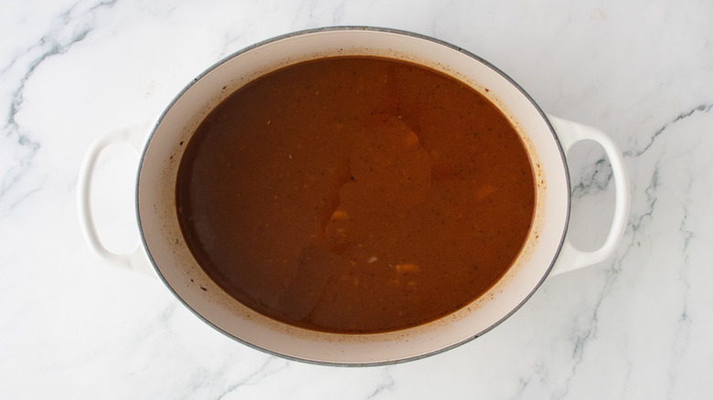 Beef broth chili mixture in large pot