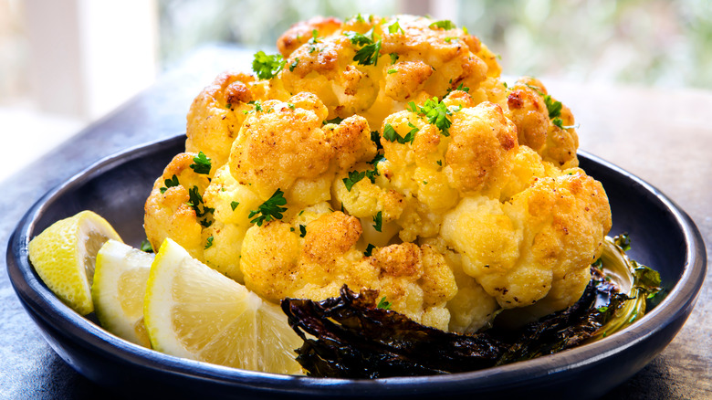 roasted cauliflower with lemon wedges