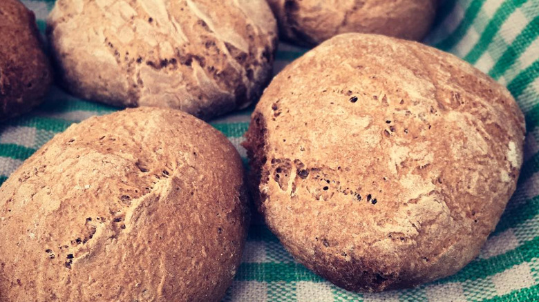 Acorn bread rolls on a checkered cloth