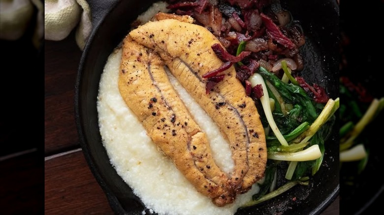 Shad roe on bed of grits with bacon and greens
