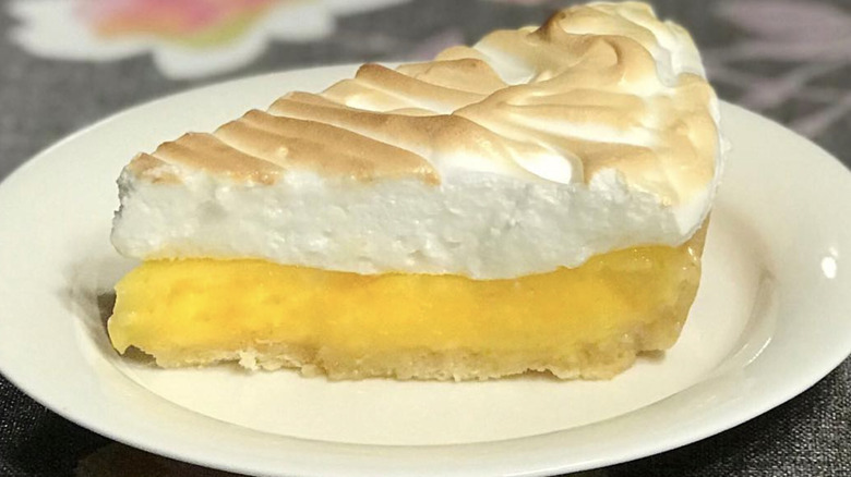 Slice of orange merengue pie with toasted top