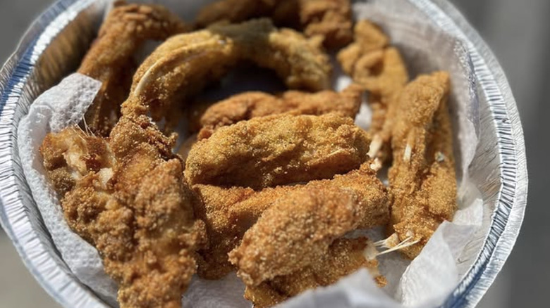 Aluminum pie plate with battered buffalo fish ribs