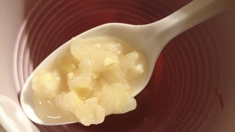 Plastic spoon with corn porridge
