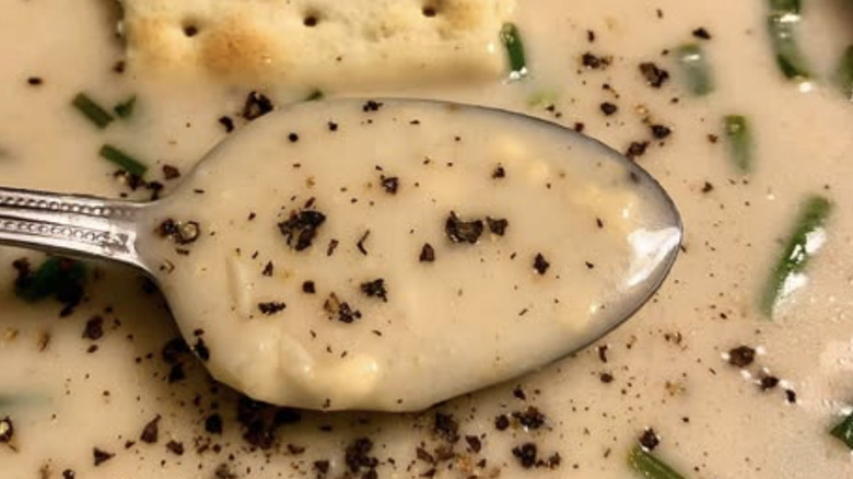 Close-up of cottage cheese soup with chives