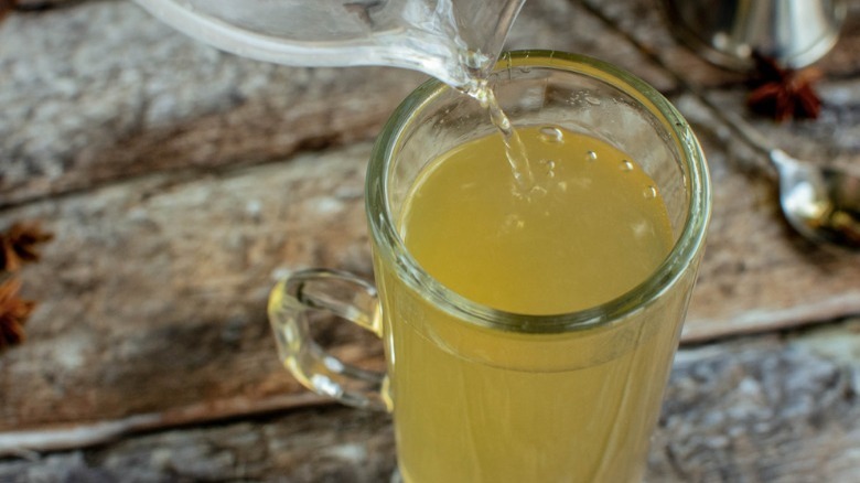 pour boiling water into glass mug