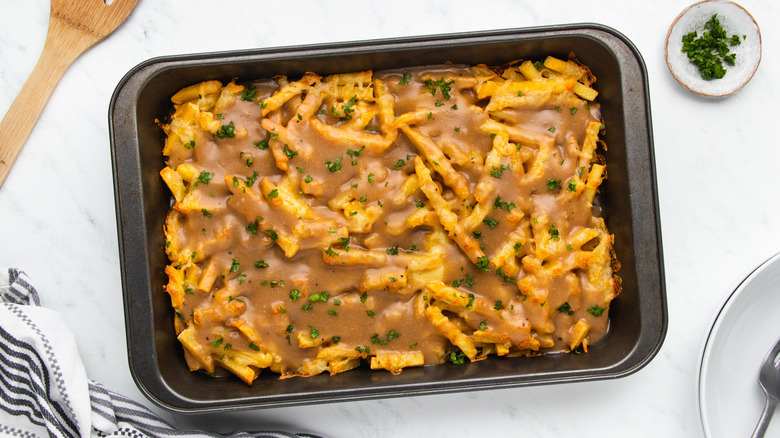 Disco fries with gravy in baking dish