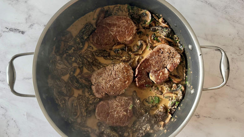 Steak Diane with creamy mushroom sauce in skillet