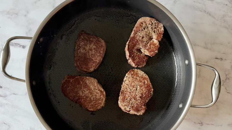 Seared steaks in skillet