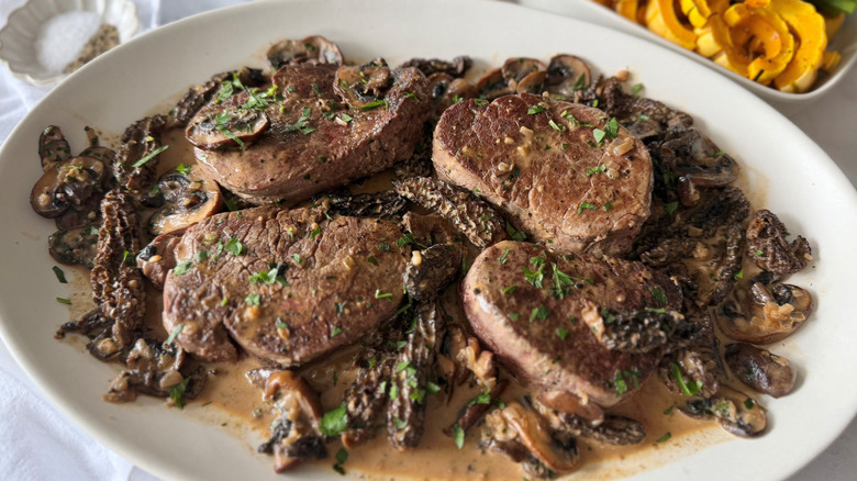 Steak Diane with mushrooms on serving platter