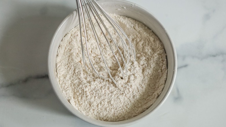 Flour and whisk in bowl