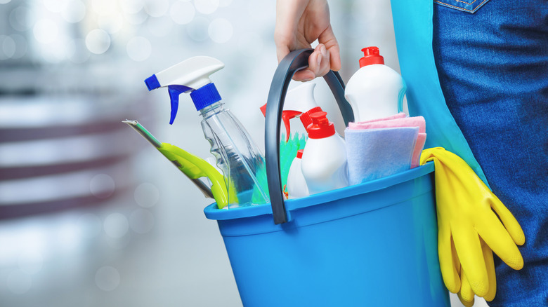Kitchen cleaning supplies in a bucket