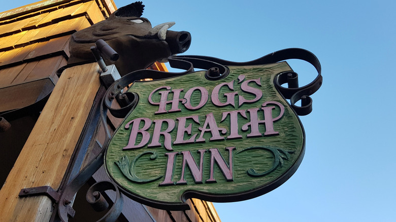 Entrance sign at Hog's Breath Inn restaurant