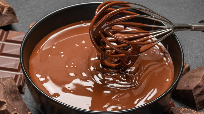 Whisking melted chocolate in pan