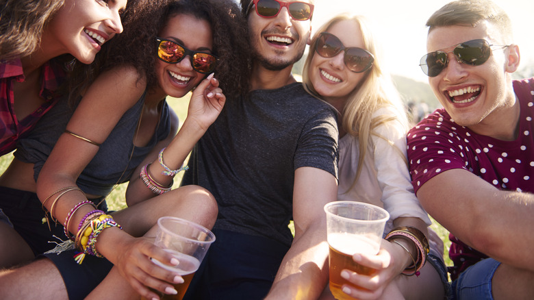 people drinking beer at festival
