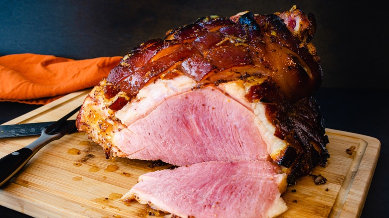 glazed ham on cutting board