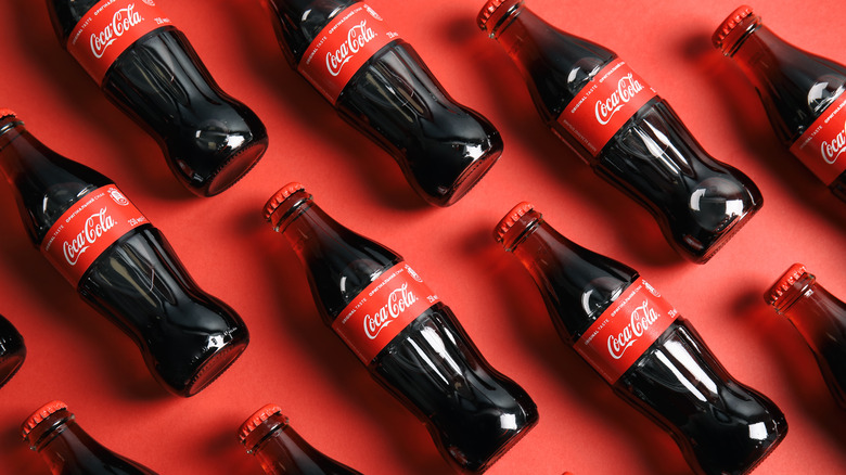 Coca-Cola bottles on red background