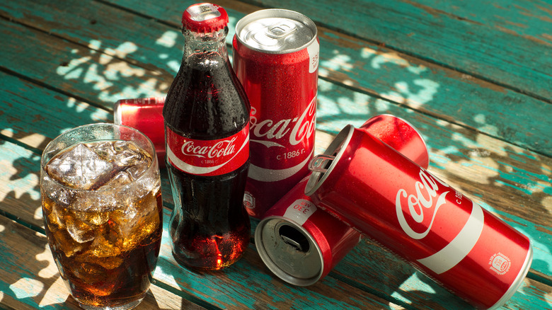 Coca-cola products on a picnic table