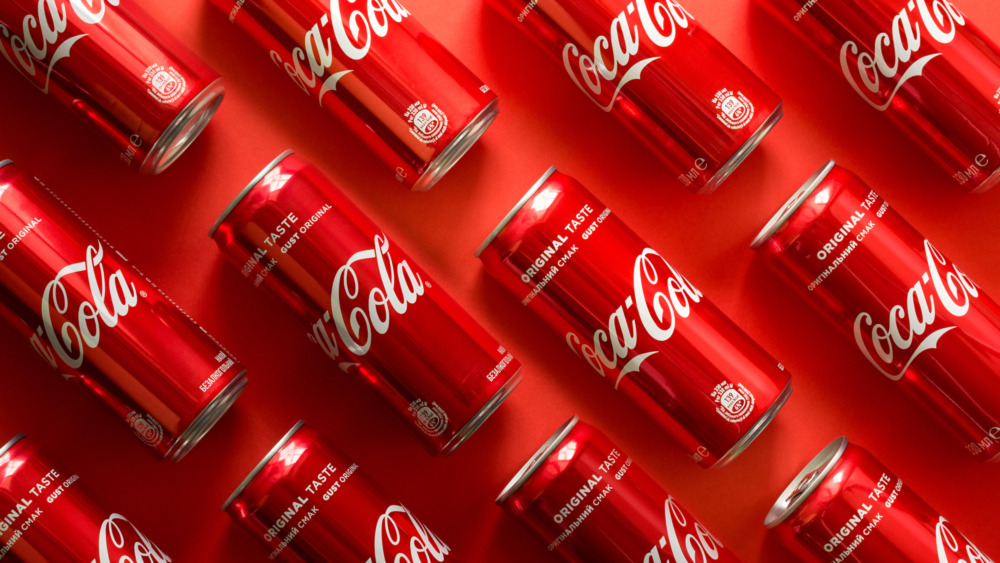 Coca-Cola bottles on red background