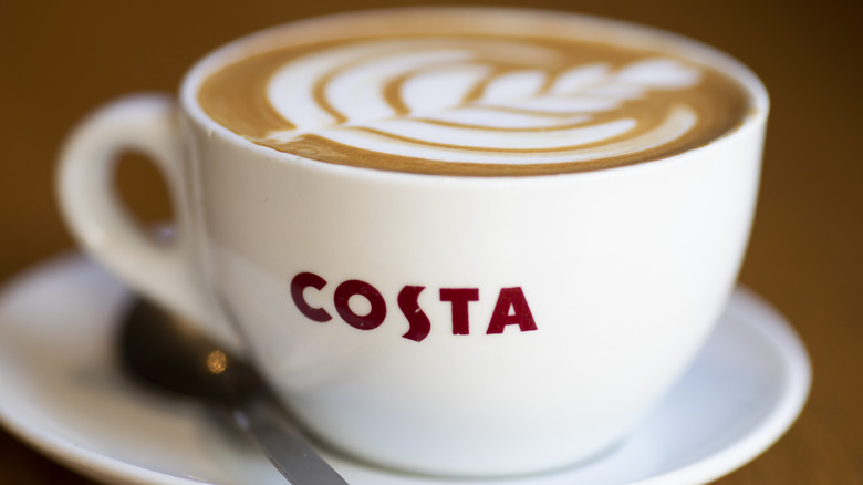 Cup of Costa Coffee with latte art