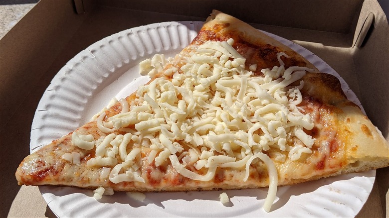 cold shredded cheese on pizza