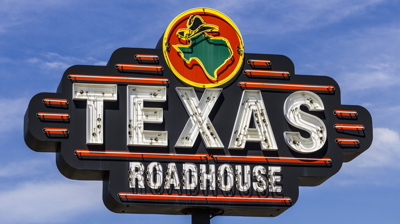 Texas Roadhouse sign blue sky