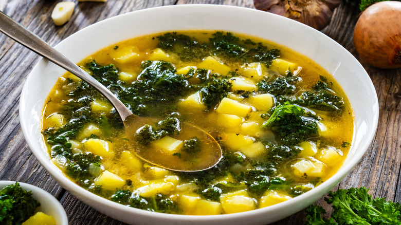 kale soup on wooden table