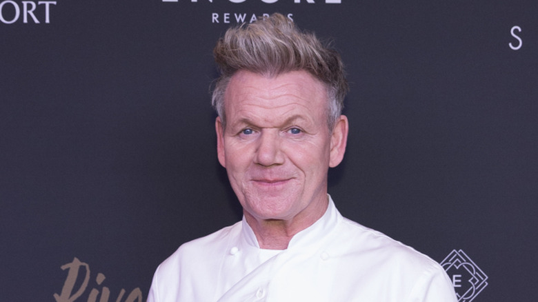 chef Gordon Ramsay smiling for cameras at publicity event