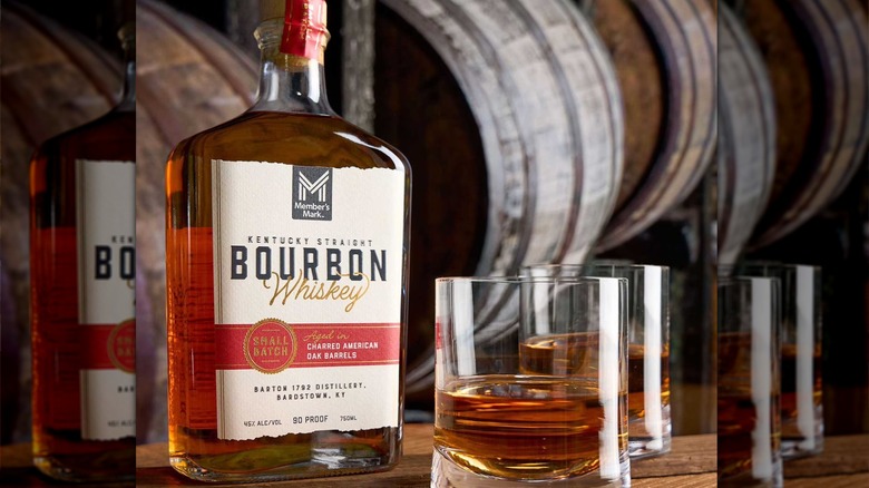 Member's Mark bottle of bourbon with two glasses of whiskey on the side