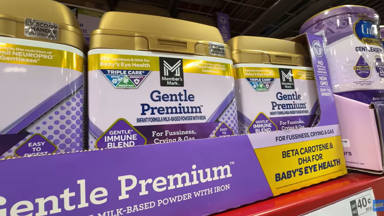 Large cans of Member's Mark Gentle Premium infant formula on a shelf